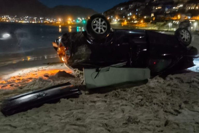 Vehicle ends up on Glencairn Beach after horror crash – WATCH