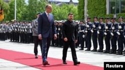 Merz, Zelenskyy Accuse Putin Of Stalling On Cease-Fire Efforts