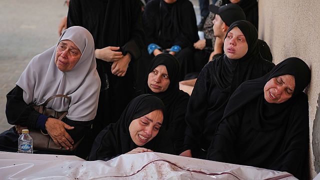Palestinians mourn the 11 victims of an attack in Khan Younis
