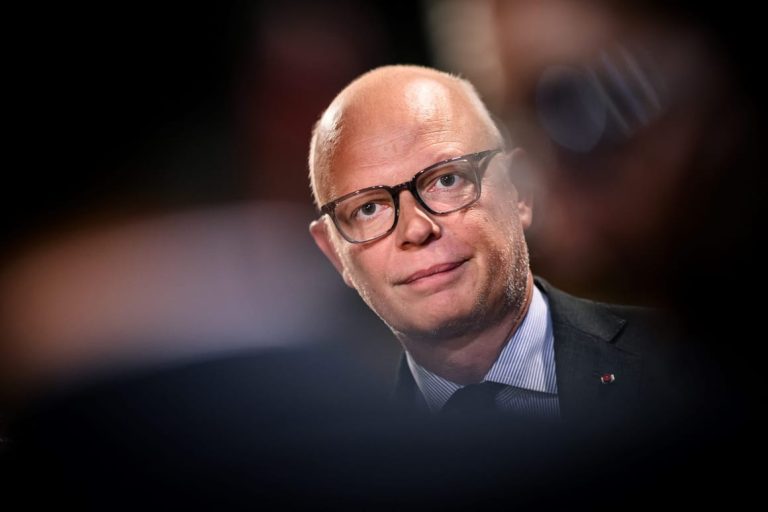 Macron should step down, his former PM says