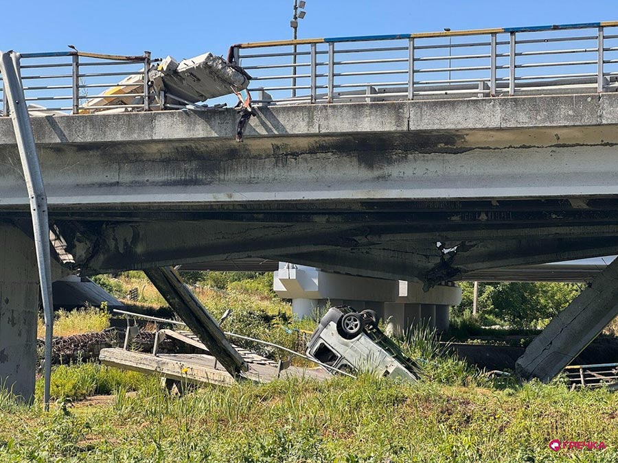 A car is overturned under the Romanivskyi Bridge in Irpin, Ukraine.