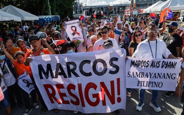 Marcos Cashiers Aides in Attempt to Contain Scandal