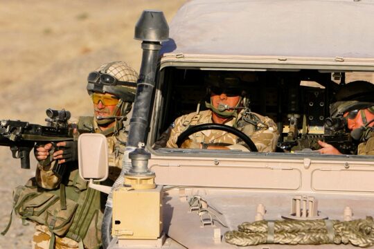 British soldiers from the Royal Air Force conduct a patrol outside Kandahar Air Field, Afghanistan.