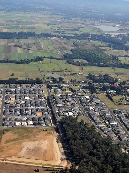 Building more homes on farmland touted as solution to housing crisis