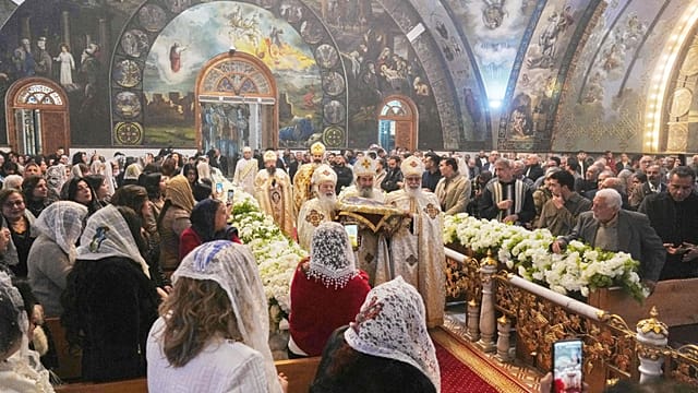 Egypt’s Coptic Orthodox Christians attend Mass to celebrate Christmas Eve