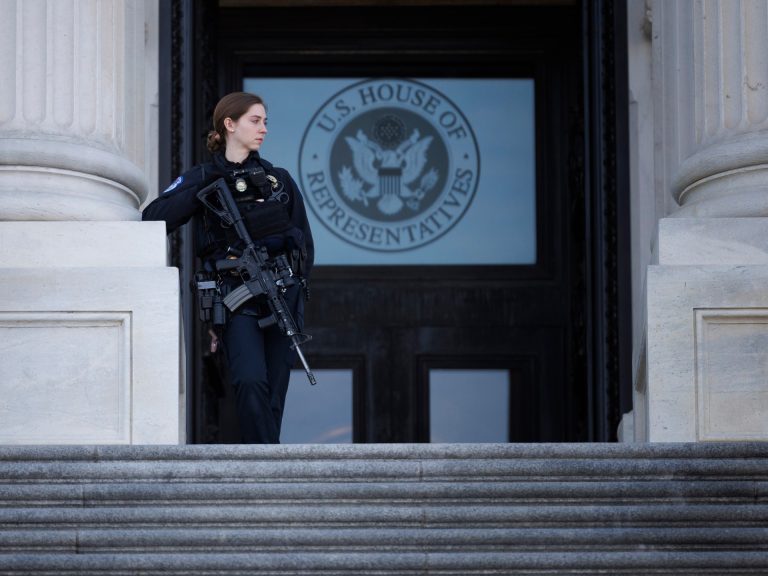 Man with shotgun running towards US Capitol building arrested by police