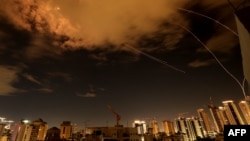 ‘Business As Usual’ As Attacks Go On Amid Uncertainty Over Iran Peace Plans