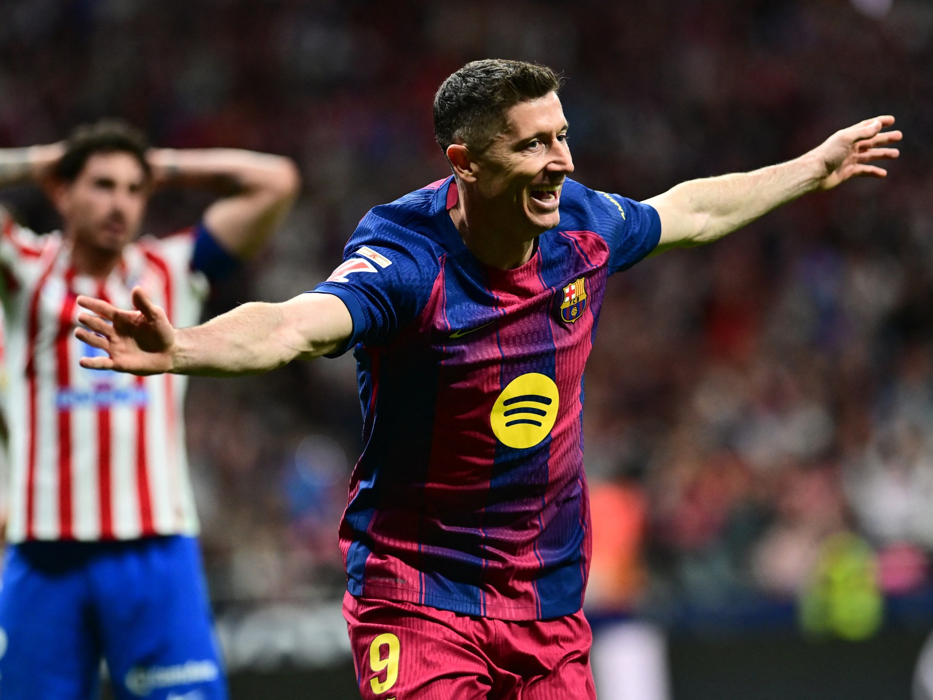 Lewandowski claims late La Liga win for Barcelona at Atletico