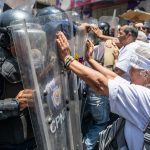 Police in Venezuela block protesters calling for higher wages, pensions