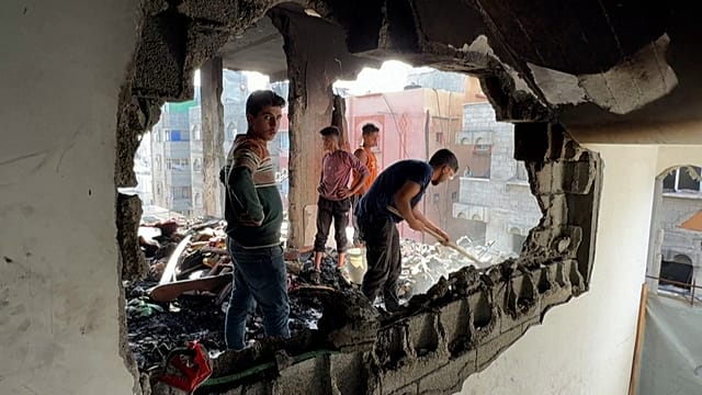 Gaza city residents survey destruction after overnight Israeli airstrike