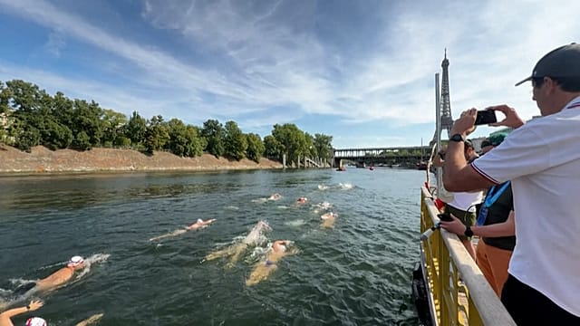 France: hundreds dive into the Seine for Paris’ first river race in 80 years