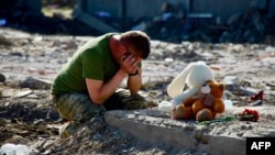 Russian Missile Strike On Ukrainian Village Kills Almost Entire Family