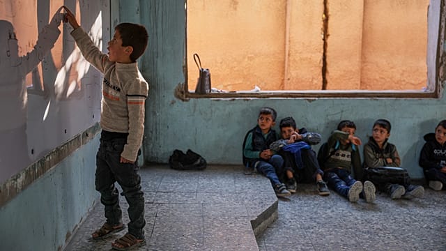 Nearly two years after the fall of Assad, Syrian children return to school amid ruins