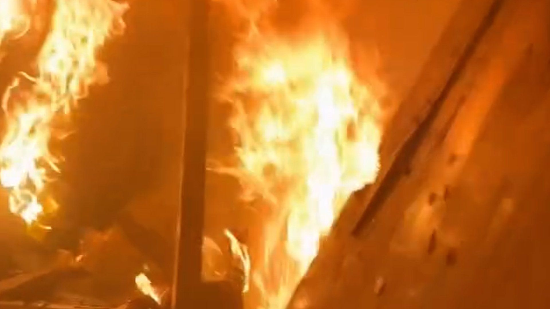 Girl rescued from flaming apartment after Israeli attack on Gaza