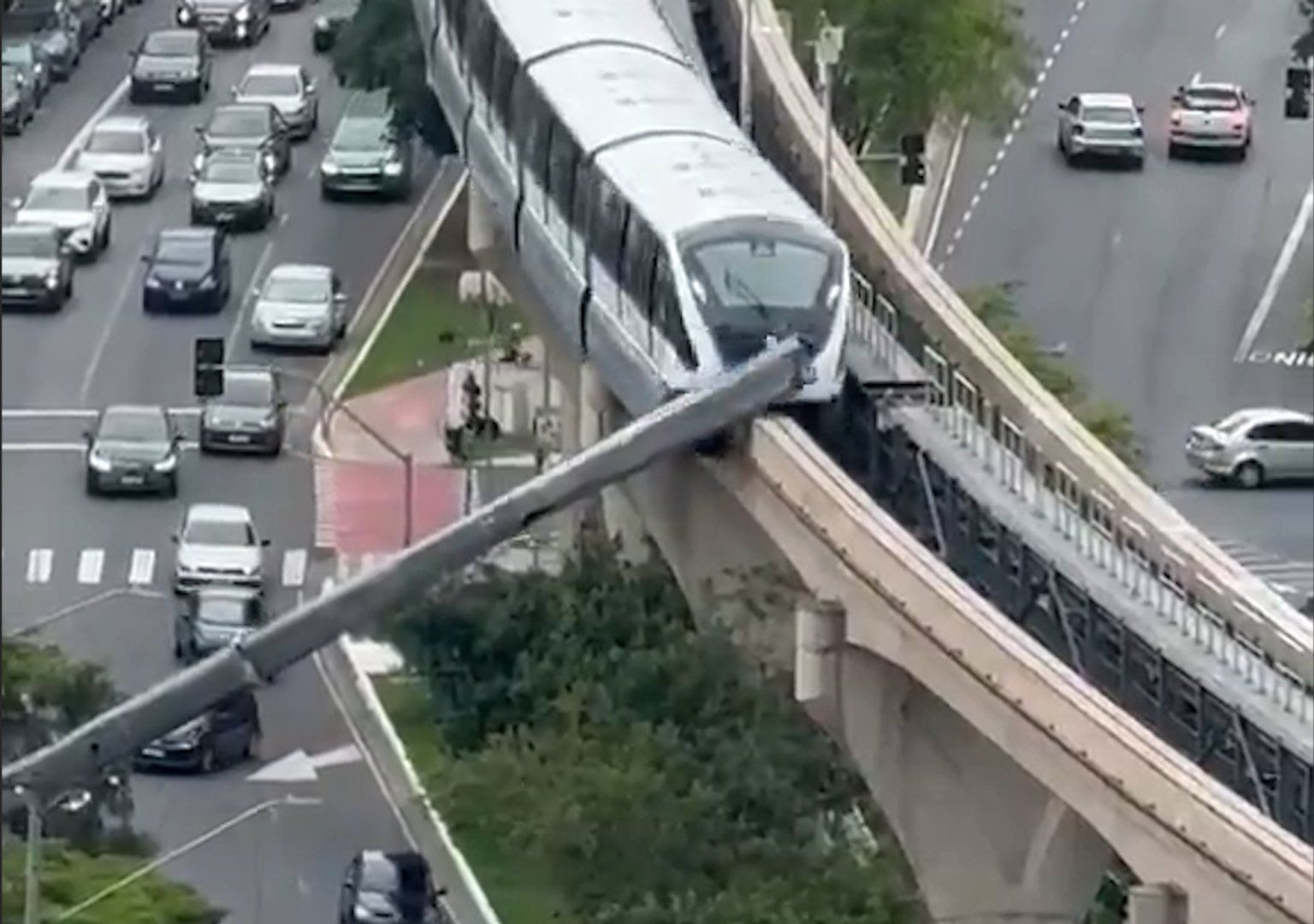 Train slams into crane that collapsed onto railway line in Brazil